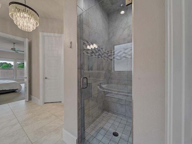 8505 Tierra Ct, Benbrook, TX 76126 - ensuite bathroom featuring tile patterned flooring, baseboards, a stall shower, ensuite bathroom, and ceiling fan with notable chandelier
