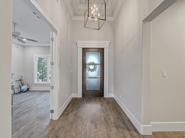 8505 Tierra Ct, Benbrook, TX 76126 - entryway featuring crown molding, baseboards, dark wood-style flooring, and ceiling fan with notable chandelier