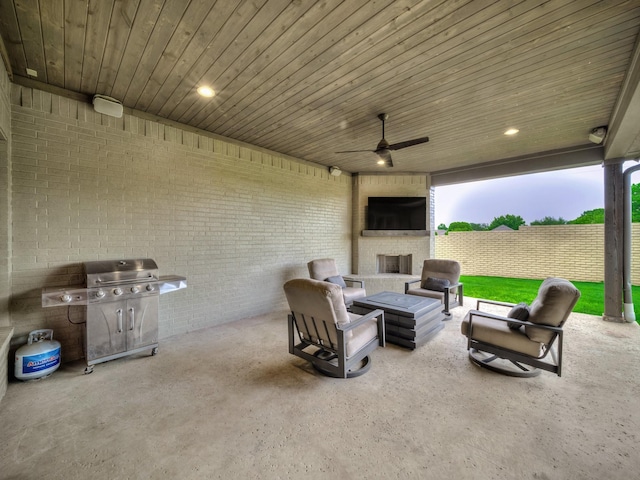 8505 Tierra Ct, Benbrook, TX 76126 - view of patio / terrace featuring an outdoor living space with a fireplace, ceiling fan, a fenced backyard, and area for grilling