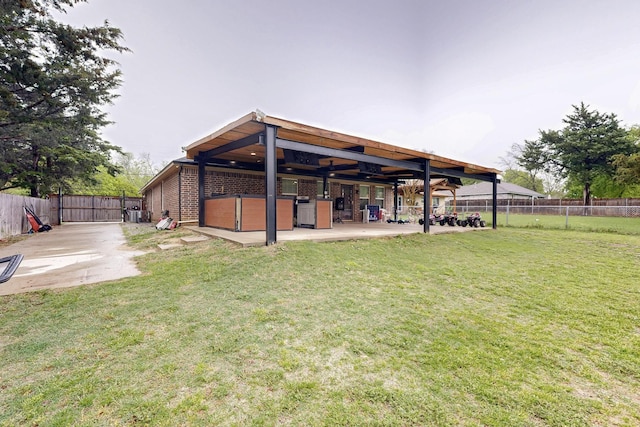 510 Springtime Dr, Cedar Hill, TX 75104 - rear view of property with a patio and brick siding