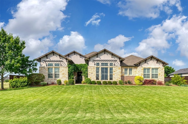 431 Lakepoint Cir, Prosper, TX 75078 - craftsman house featuring stucco siding, stone siding, and a front lawn