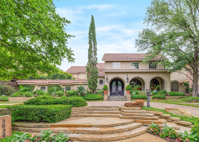 3636 Amherst Ave, University Park, TX 75225 - mediterranean / spanish home with stucco siding, french doors, and a tiled roof