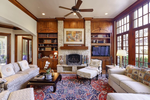 3636 Amherst Ave, University Park, TX 75225 - living room featuring crown molding, ceiling fan, a healthy amount of sunlight, and built in features