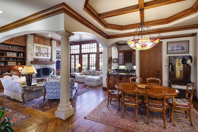 3636 Amherst Ave, University Park, TX 75225 - dining area featuring ornamental molding, wood finished floors, ornate columns, and arched walkways