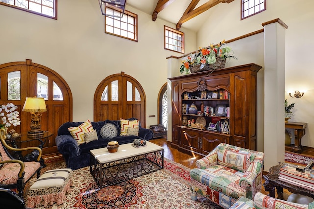3636 Amherst Ave, University Park, TX 75225 - living room with a wealth of natural light, beam ceiling, wood finished floors, and a towering ceiling