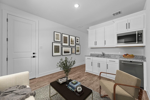 248 Diamond Dl, Lavon, TX 75166 - living room with baseboards, light wood finished floors, and recessed lighting