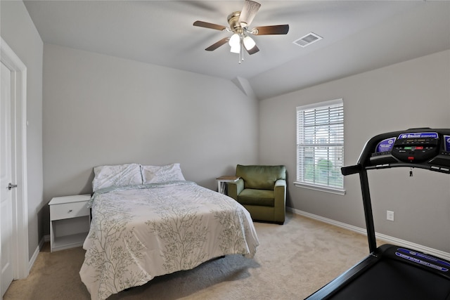 bedroom featuring visible vents, light carpet, baseboards, and ceiling fan