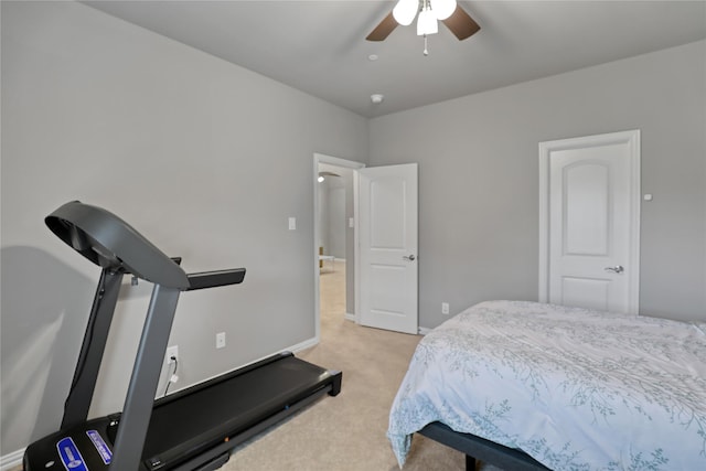 bedroom with baseboards, a ceiling fan, and light colored carpet