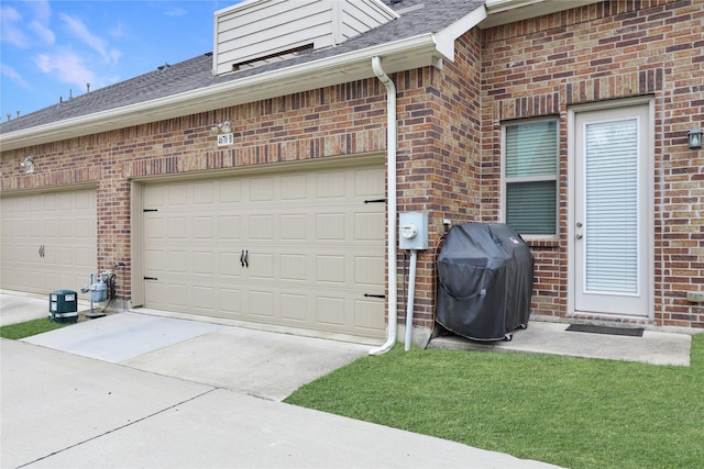 garage featuring driveway