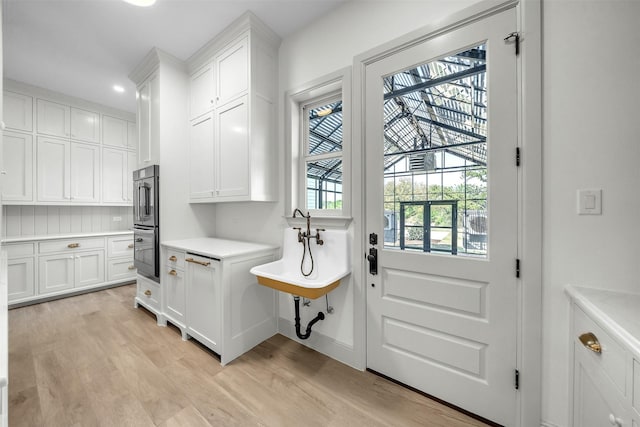 interior space with light wood-type flooring and recessed lighting