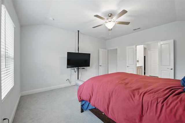 carpeted bedroom with ceiling fan, visible vents, baseboards, and lofted ceiling