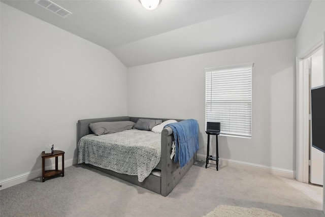 carpeted bedroom featuring multiple windows, baseboards, vaulted ceiling, and visible vents
