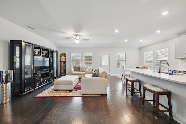 living room featuring recessed lighting, visible vents, a ceiling fan, and dark wood finished floors