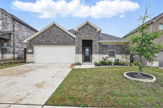 view of front facade with a front yard, an attached garage, stone siding, driveway, and roof with shingles
