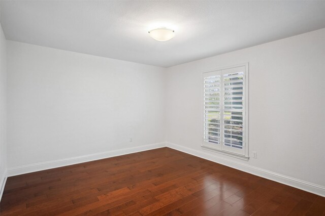 5111 Cimmaron Cir, Parker, TX 75002 - unfurnished bedroom with dark wood-type flooring, baseboards, and ensuite bath