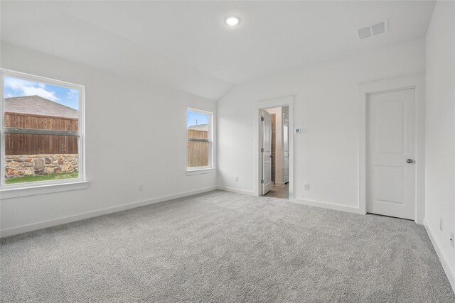 1321 Cider St, Forney, TX 75126 - unfurnished bedroom with baseboards, multiple windows, light carpet, and visible vents