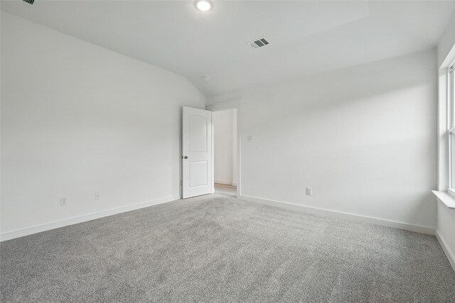 1321 Cider St, Forney, TX 75126 - carpeted empty room with baseboards, vaulted ceiling, and visible vents