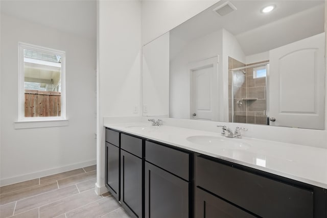 1321 Cider St, Forney, TX 75126 - bathroom featuring visible vents, a sink, a healthy amount of sunlight, and a shower stall