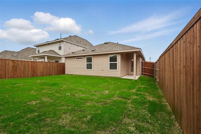 1321 Cider St, Forney, TX 75126 - back of property with a fenced backyard, a patio, and a yard