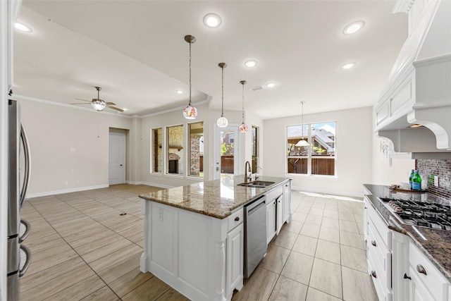 971 Abbott Ln, Allen, TX 75013 - kitchen featuring stainless steel appliances, ceiling fan, white cabinets, light tile patterned flooring, and a sink