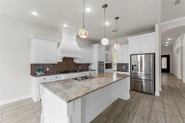 971 Abbott Ln, Allen, TX 75013 - kitchen featuring stainless steel appliances, a sink, decorative backsplash, arched walkways, and crown molding