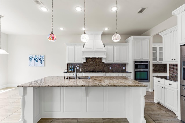 971 Abbott Ln, Allen, TX 75013 - kitchen with a sink, backsplash, stainless steel double oven, white cabinets, and recessed lighting