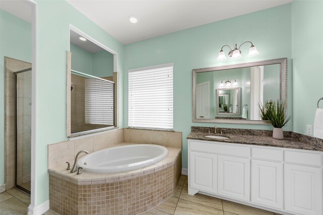 971 Abbott Ln, Allen, TX 75013 - bathroom with vanity, a bath, a stall shower, and tile patterned floors