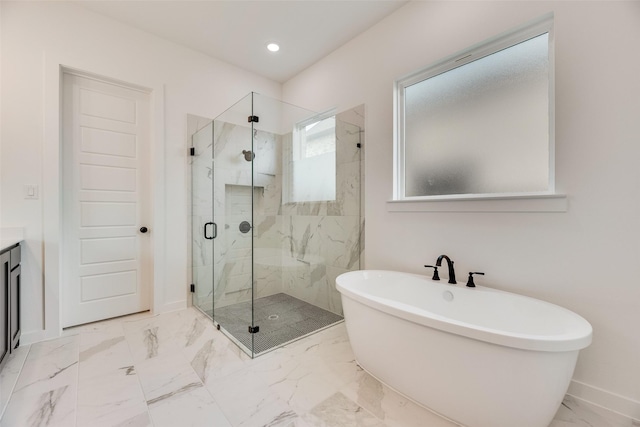 bathroom featuring a freestanding bath, a marble finish shower, baseboards, and marble finish floor