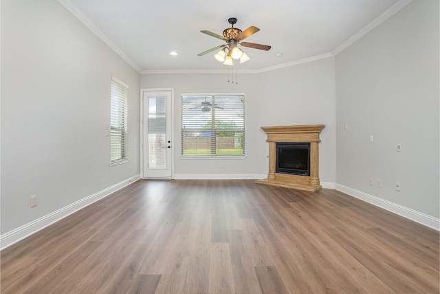 9108 Blue Water Dr, Plano, TX 75025 - unfurnished living room featuring wood finished floors, baseboards, and ornamental molding