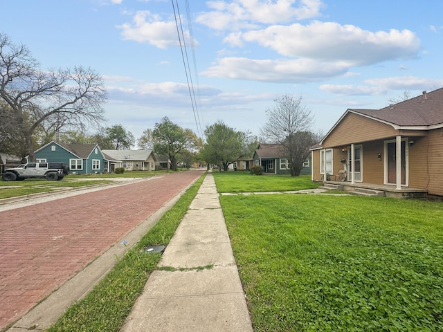 706 N Commerce St, Gainesville, TX 76240 - view of yard with a porch and a residential view