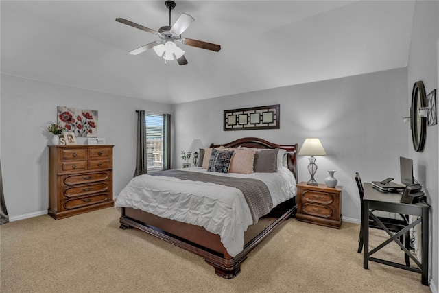 bedroom featuring light carpet, baseboards, a ceiling fan, and lofted ceiling