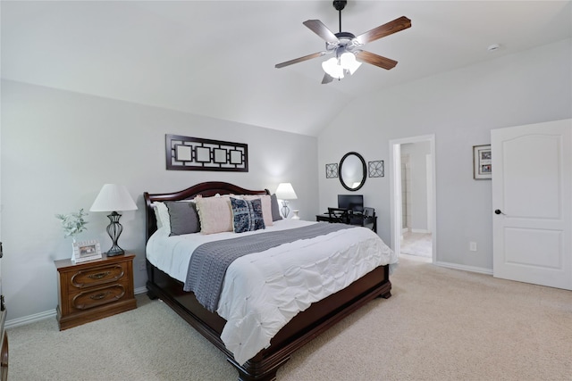 bedroom featuring baseboards, light carpet, and lofted ceiling