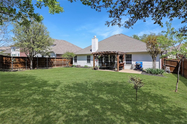 back of property with a pergola, a yard, a chimney, a fenced backyard, and a patio