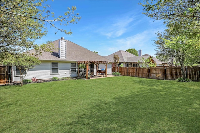rear view of property featuring a yard, a pergola, fence private yard, and a patio area