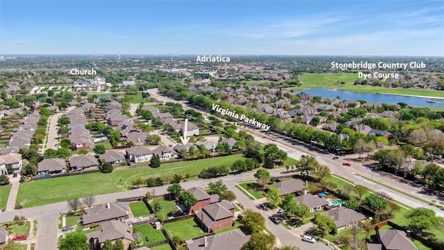 birds eye view of property with a water view and a residential view