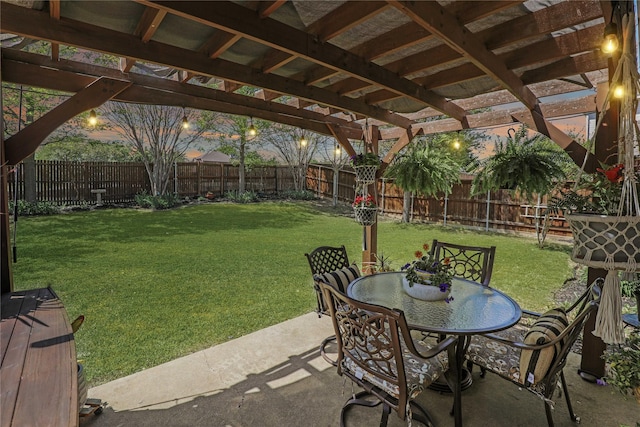view of patio with a fenced backyard, outdoor dining space, and a pergola