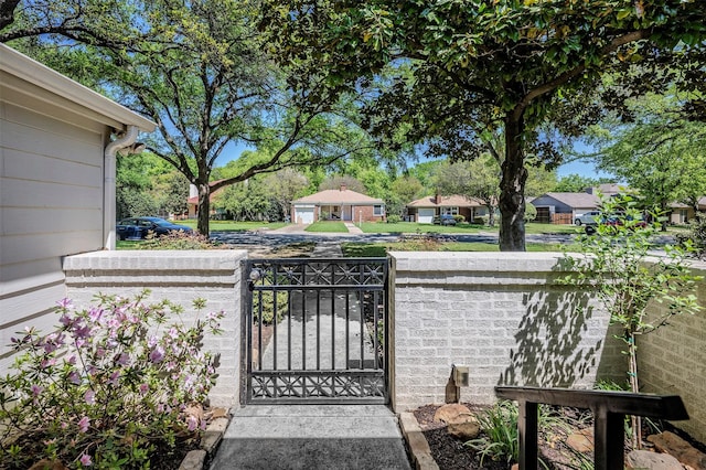 view of gate featuring fence