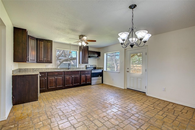 kitchen with dark brown cabinetry, baseboards, stainless steel electric range oven, ceiling fan with notable chandelier, and a sink