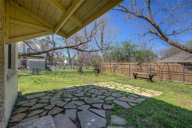 view of yard featuring a patio area and a fenced backyard