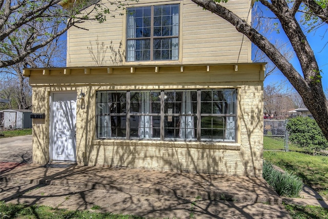 back of property featuring fence