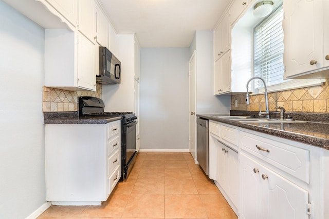 kitchen featuring a sink, black appliances, and white cabinetry