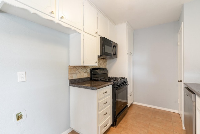 kitchen featuring tasteful backsplash, white cabinets, black appliances, light tile patterned flooring, and dark countertops