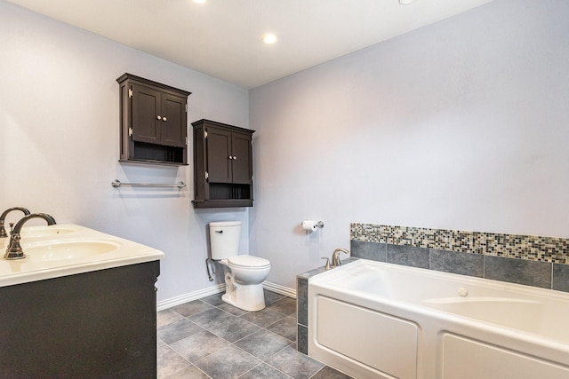 bathroom with a bath, baseboards, a sink, toilet, and tile patterned flooring