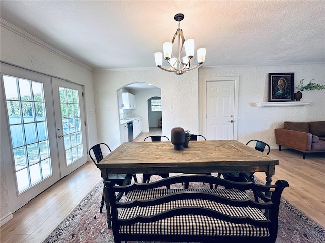 1317 N Mary St, Comanche, TX 76442 - unfurnished room featuring plenty of natural light, light wood-type flooring, a ceiling fan, ornamental molding, and a textured ceiling