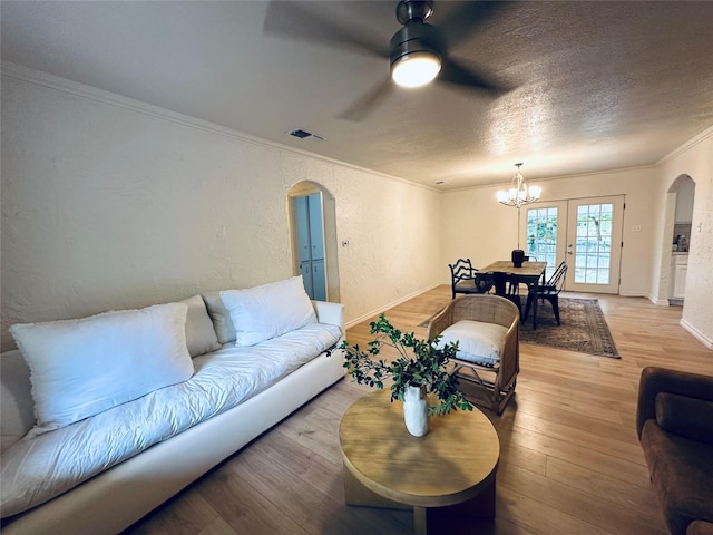 1317 N Mary St, Comanche, TX 76442 - corridor featuring arched walkways, ornamental molding, wood finished floors, and a textured wall