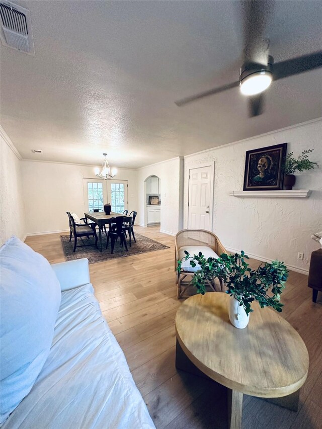 1317 N Mary St, Comanche, TX 76442 - laundry room featuring cabinet space, washer hookup, baseboards, light wood-style flooring, and hookup for an electric dryer