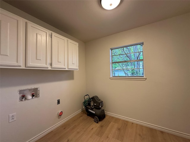 1317 N Mary St, Comanche, TX 76442 - laundry area with cabinet space, hookup for a washing machine, baseboards, light wood-style flooring, and hookup for an electric dryer