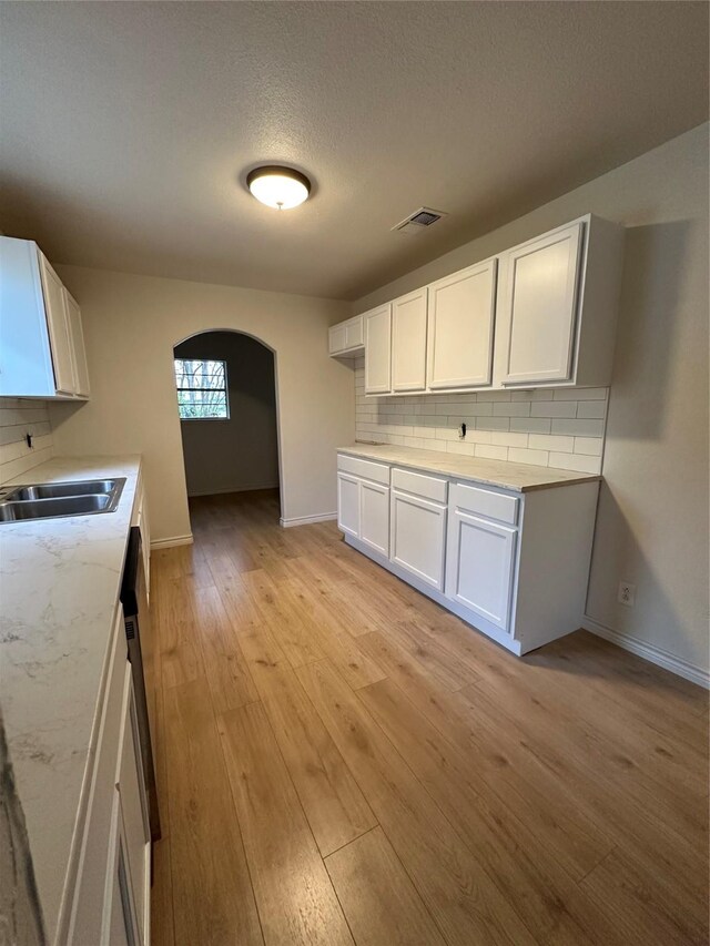 1317 N Mary St, Comanche, TX 76442 - empty room featuring a textured ceiling, wood finished floors, crown molding, a ceiling fan, and baseboards