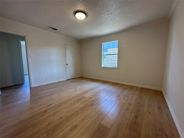 1317 N Mary St, Comanche, TX 76442 - empty room featuring crown molding, wood finished floors, ceiling fan, a textured ceiling, and baseboards