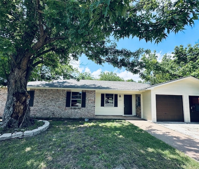 1317 N Mary St, Comanche, TX 76442 - single story home with an attached garage, a front yard, and concrete driveway